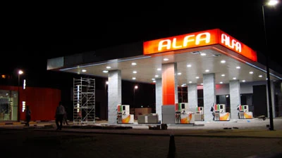 Alfa petrol filling station lit at night